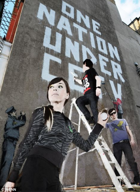 A new Banksy mural â€˜One Nation Under CCTVâ€™ painted next to a CCTV camera at a Post Office yard in the West End. (Image: Dailymail.co.uk)